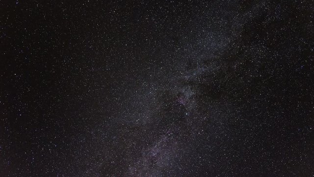4K Timelapse of the Milky Way Galaxy in the region of the celestial Summer Triangle moving through the starry night sky with clouds appearing at the end