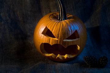 Scary jack-o-lantern on black background close up