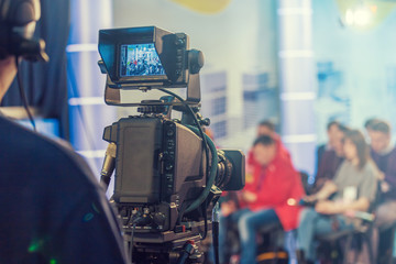 Cameraman shooting in studio