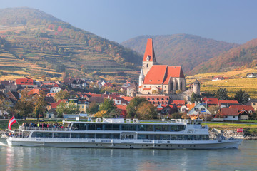 Weissenkirchen village with boat on Danube river in Wachau, Austria