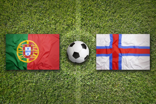 Portugal vs. Faeroe Islands flags on soccer field