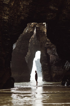 Man standing at cave