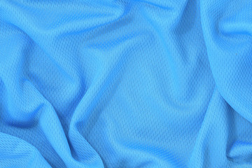 Blue jersey polyester fabric texture background, sports wear background.