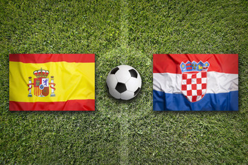 Fototapeta premium Spain vs. Croatia flags on soccer field