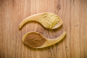 different seasoning is poured into wooden spoons. Flat lay