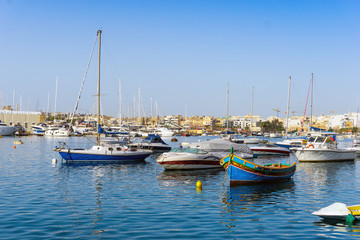 Fototapeta premium Mediterranean traditional colorful boats in Malta