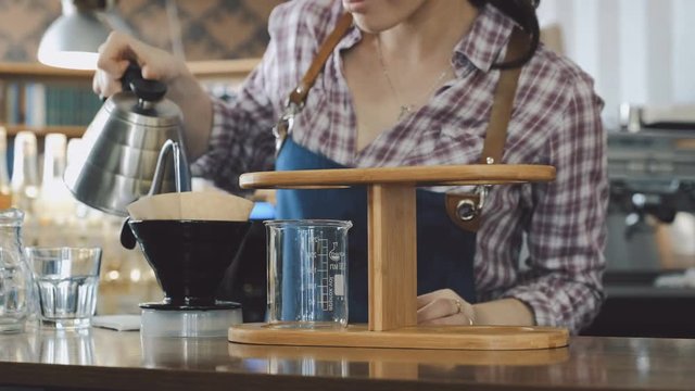 Barista making drip coffee 