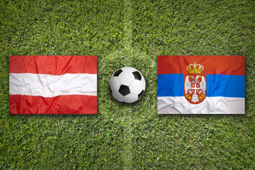 Austria vs. Serbia flags on soccer field