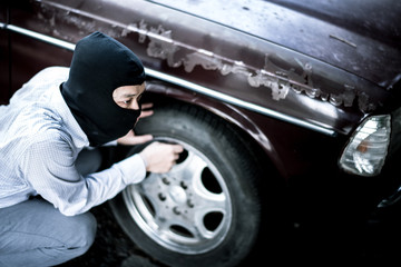 robber in black mask. robbery and crime concept.