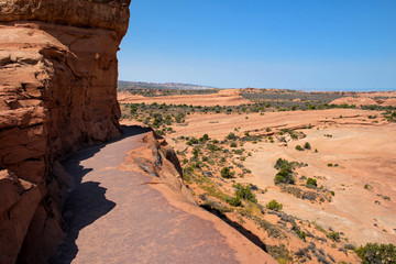 Arches National Park: Walking trail to Delicate Arch, Utah, USA. The trail leads along the edge of a cliff and offers unique views over the park. © idoerenberg