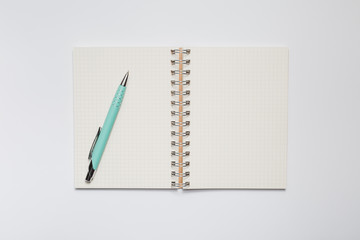 School notebook with stylish green pen - Powered by Adobe