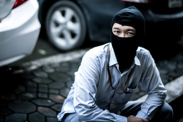 robber in black mask. robbery and crime concept.