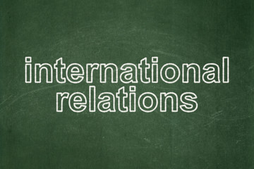 Obraz premium Politics concept: International Relations on chalkboard background
