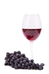 Fresh grapes and a glass of red wine