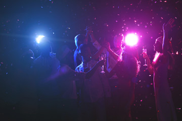 Obraz na płótnie Canvas Group of friends at christmas party at night club