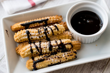Spanish Dessert Churros with Chocolate Sauce / Baked Sweet Dough.