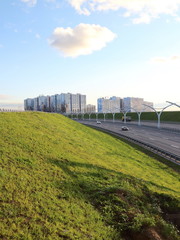 high-speed road at sunset over the sea city	