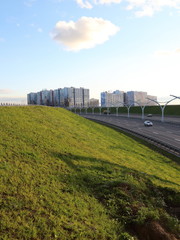 high-speed road at sunset over the sea city	