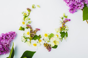 Spring flowers in the shape of a crescent on a white background