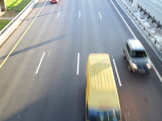 high-speed road at sunset over the sea city	