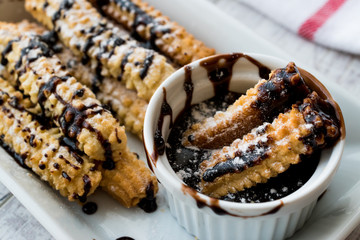 Spanish Dessert Churros with Chocolate Sauce / Baked Sweet Dough.