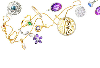 Falling many beautiful jewelry with precious stones isolated on white background. Luxury glamorous...