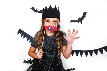 Happy girl in a halloween costume having fun