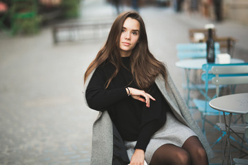 Beautiful young woman posing on the street in old city
