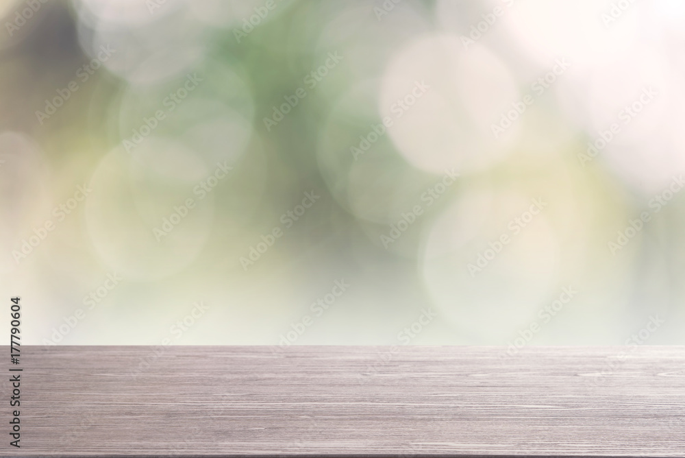 Wall mural top empty wood table on blurred abstract nature background. can be used for display or montage your 