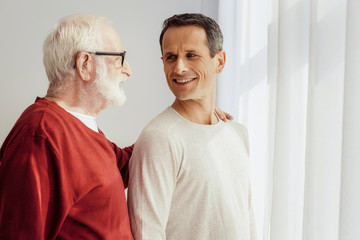Positive delighted relatives having warm conversation