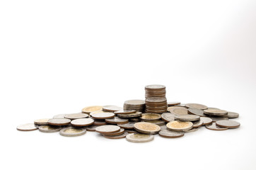 pile of money coins on white background, saving money, business, investment, finance and banking concept, soft focus