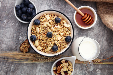 Oat flakes with milk, honey, blueberries, raspberries and nuts.