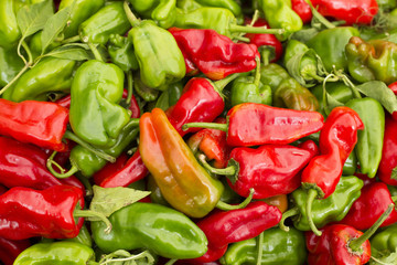Red and green peppers on the market