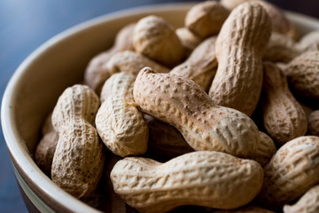 Bowl of Dry Salted Roasted Peanuts in Shell.