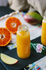 Fresh natural mango and orange fruits smoothie.