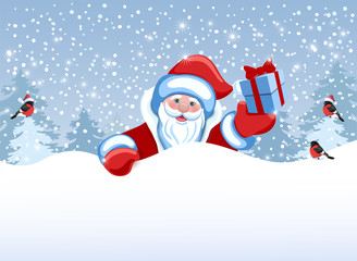 Santa Claus holds poster in the form of a snowdrift for advertise discounts, sales or an invitation to celebrate Сhristmas.
