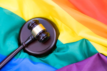 Hammer and gavel again against rainbow flag