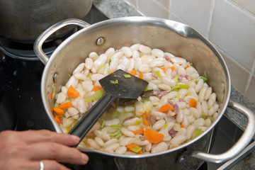 large casserole with cooked white beans