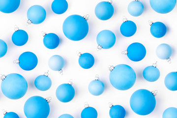 Christmas composition. Pattern made of  blue Christmas balls on wite background. Flat lay, top view