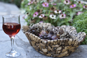 Red vine and a basket of dried fruit