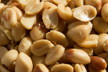 A close up macro shot of peanuts. This image can be used to represent snacks or peanut allergies