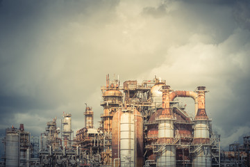 Oil refinery, oil factory, petrochemical plant in Pasadena, Texas, USA under cloudy sky. Vintage...