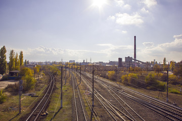 Fototapeta na wymiar Railroad rails in autumn city