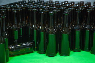 brown empty bottles are prepared for bottling beer
