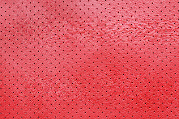 Red perforated leather texture background