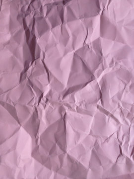 Close up of crumpled piece of colorful construction paper