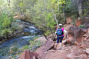 A Woman Hikes Toward Sedona's Famous Cathedral Rock