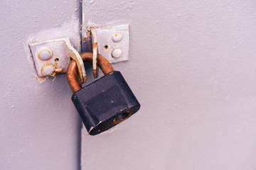 Old black grunge door lock at iron door background, vintage, Closeup.