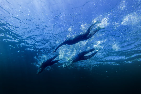 Race Leader In Group During Triathlon Swim Stage Underwater