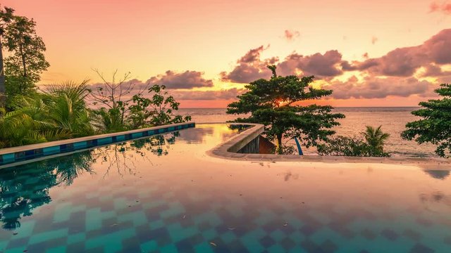 Beautiful tropic timelapse Sunset over infinity Pool in Bali